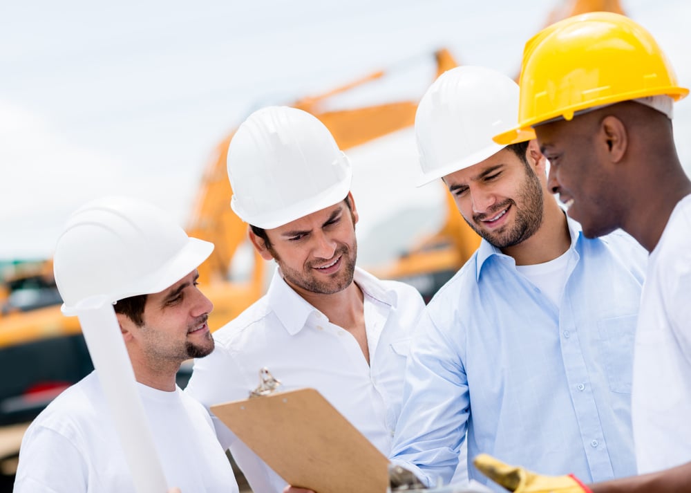 Group of engineers talking at a construction site