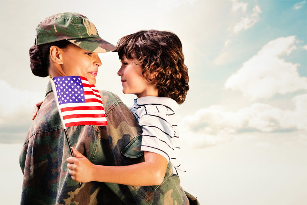 Solider reunited with son against blue sky